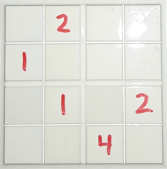 photo of 3D printed 4x4 sudoku grid with dry erase marker numbers on the cells